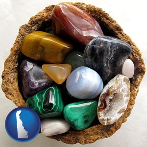 an assortment of polished gemstones - with Delaware icon