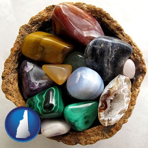 an assortment of polished gemstones - with New Hampshire icon